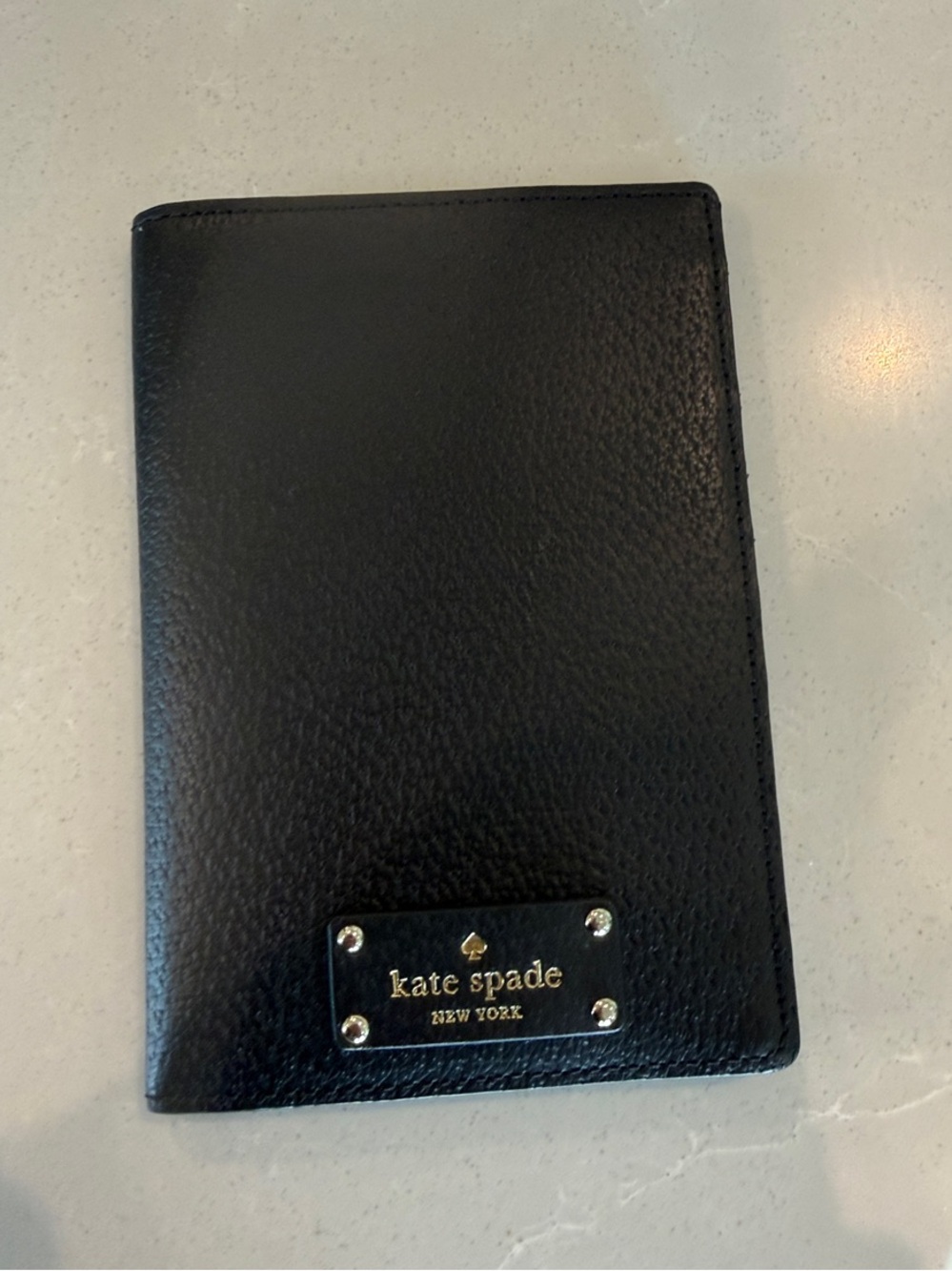 kate spade Black Pebbled Leather Passport Cover with Gold Plaque